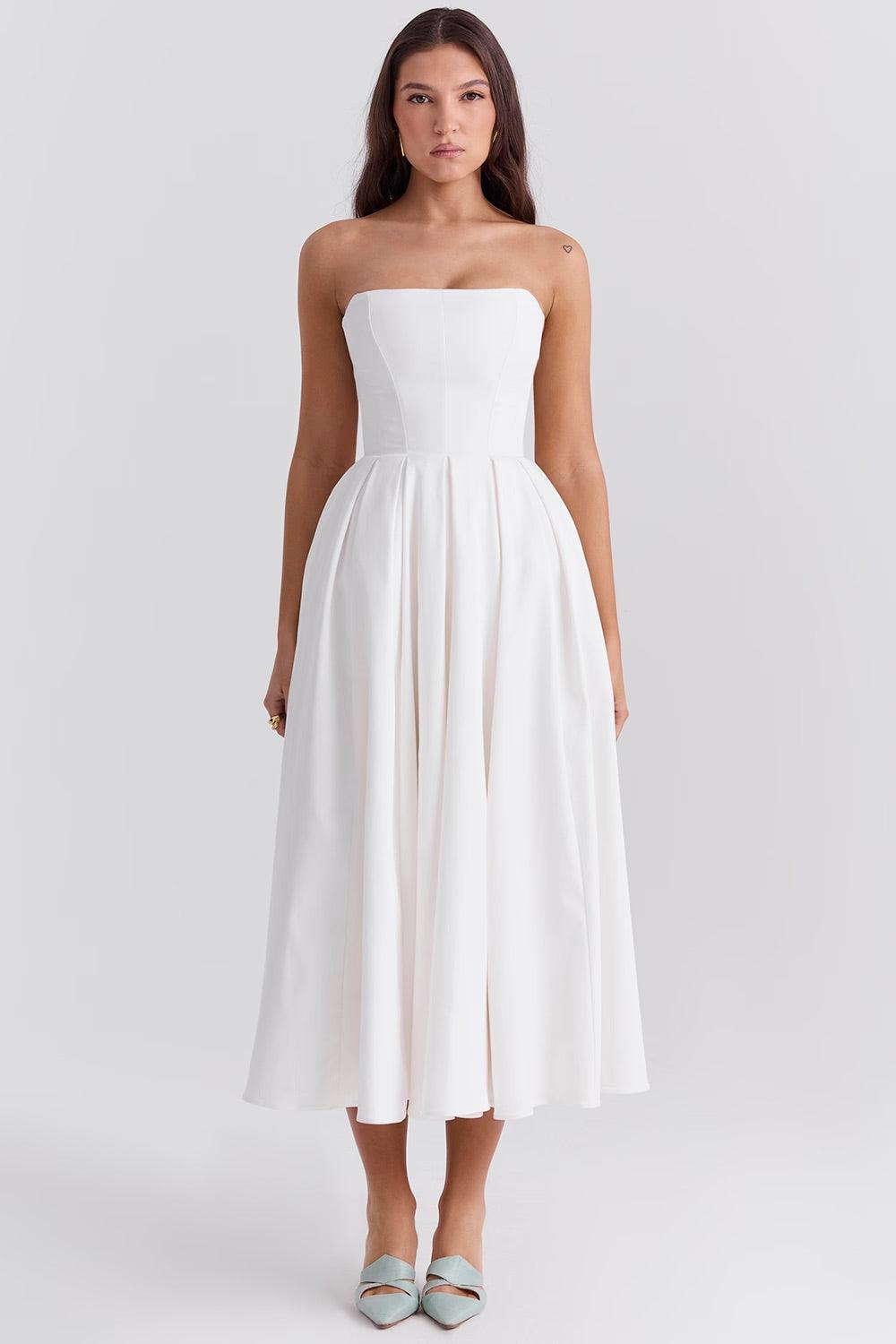 Vestido Midi Calista branco com corset estruturado e saia plissada volumosa, ideal para eventos sofisticados. Majestique.