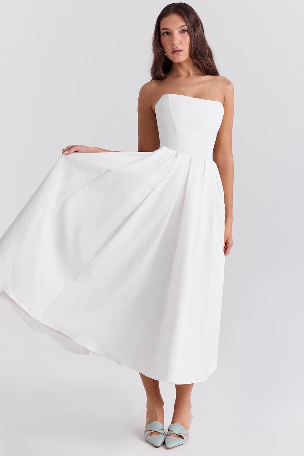 Vestido Midi Calista branco com corset estruturado e saia plissada volumosa, ideal para eventos sofisticados. Majestique.1