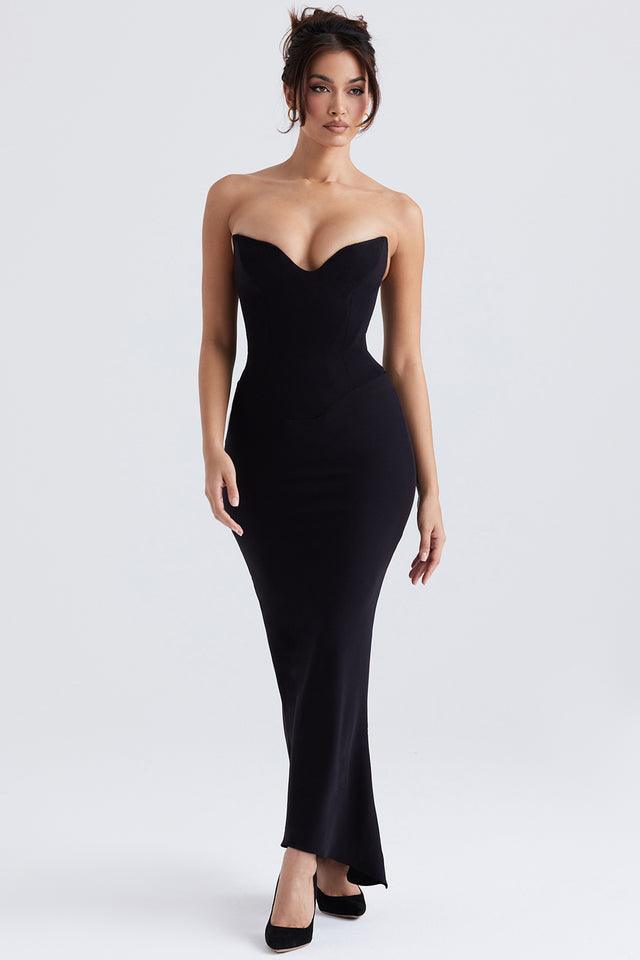 Vestido Longo Brielle em crepe elástico preto com corset estruturado e fenda assimétrica, ideal para eventos sofisticados. Majestique.
