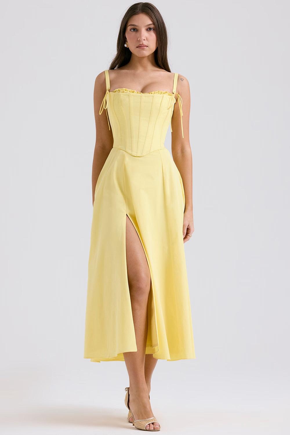 Vestido Midi Soleil em algodão pima amarelo com corset removível e saia fluída, ideal para eventos sofisticados. Majestique.