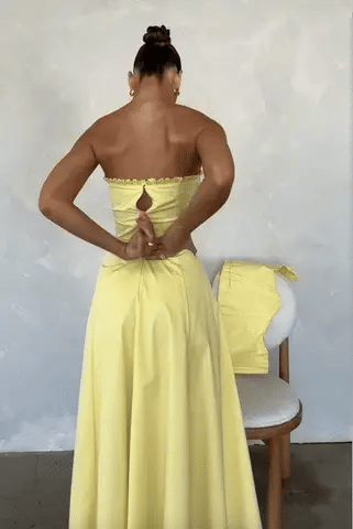 Vestido Midi Soleil em algodão pima amarelo com corset removível e saia fluída, ideal para eventos sofisticados. Majestique.1